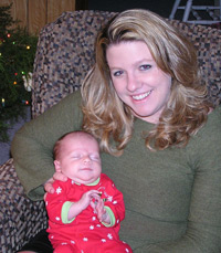 Becca with her daughter, Abby, a healthy, breastfed newborn, at Christmas 2005.