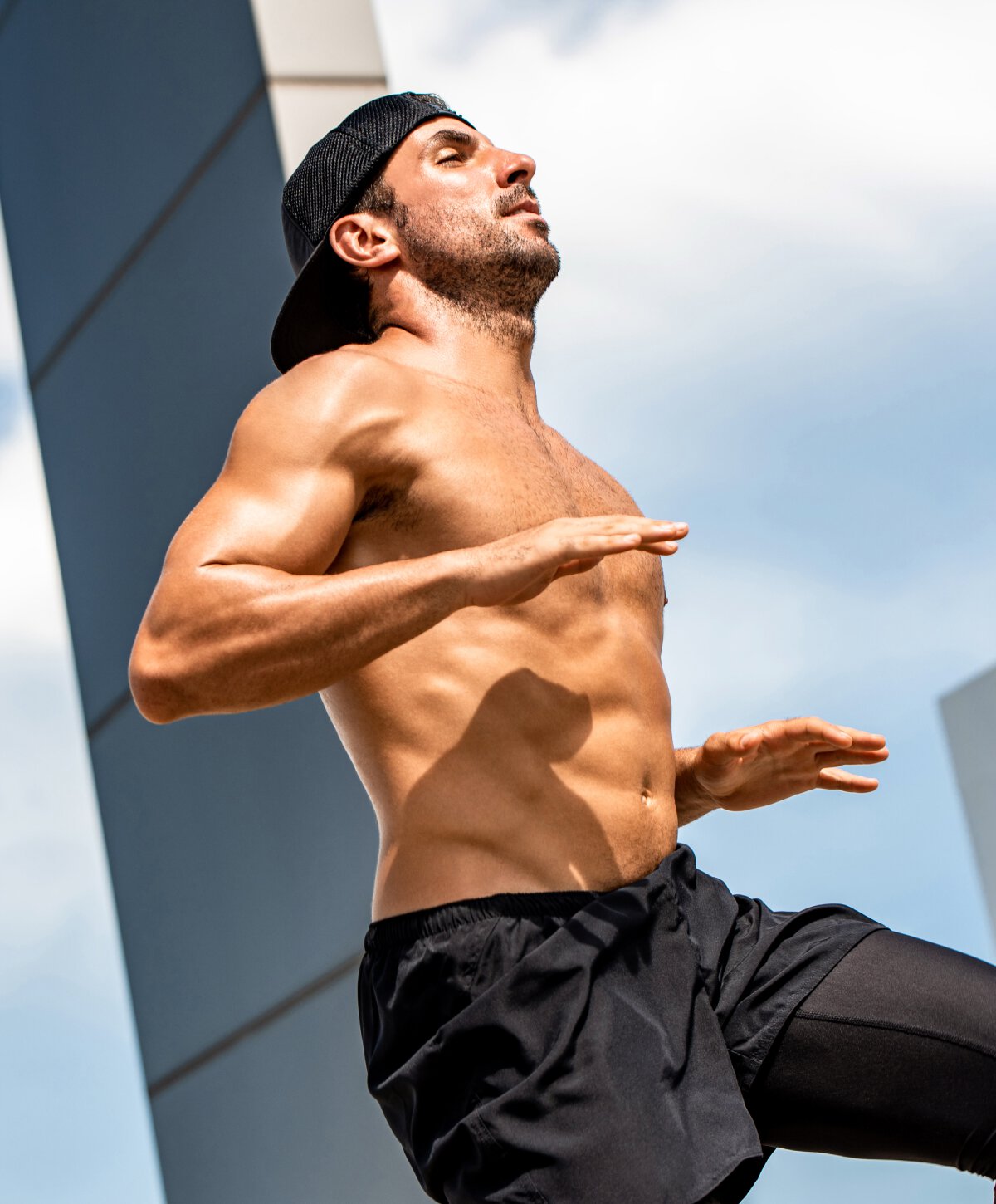 Los Angeles liposuction for men model with black shorts