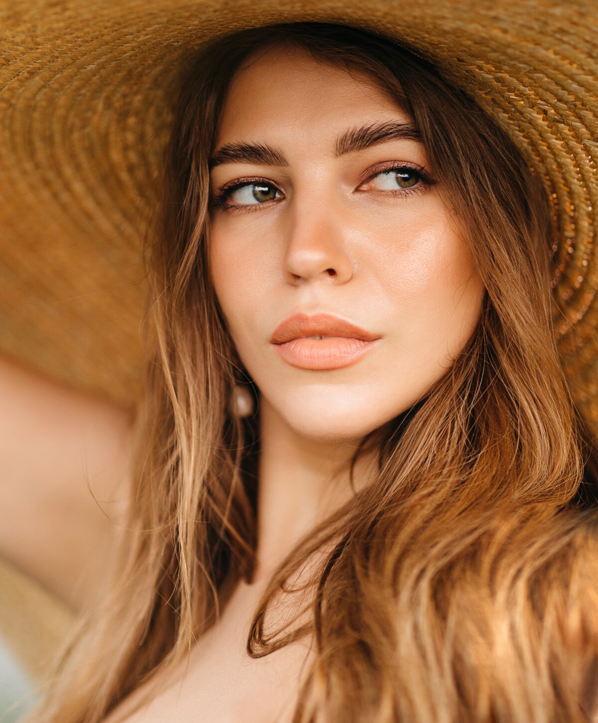 Los Angeles Hydrafacial model wearing hat