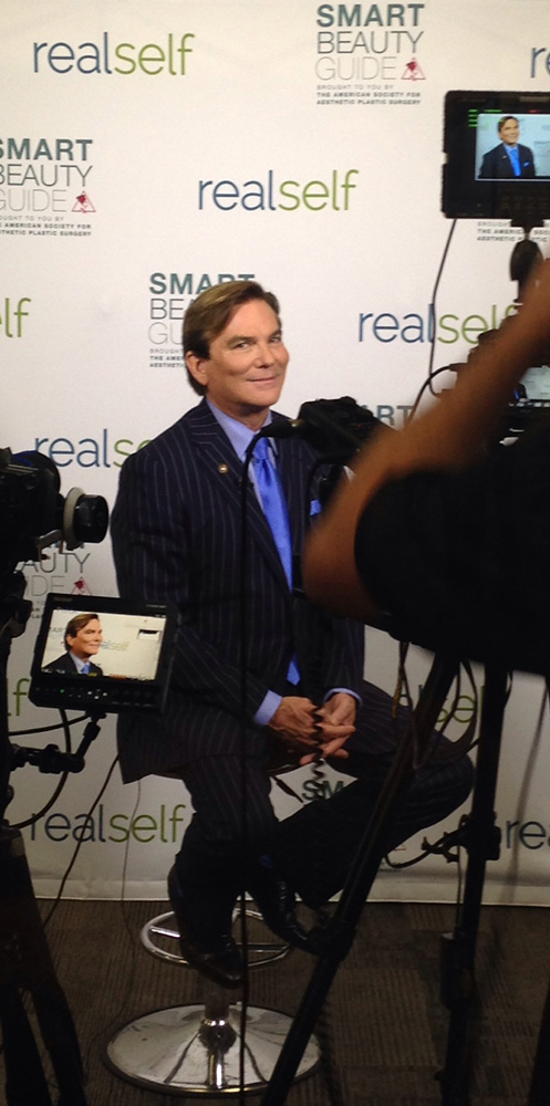 los angeles plastic surgeon dr grant stevens giving interview side angle